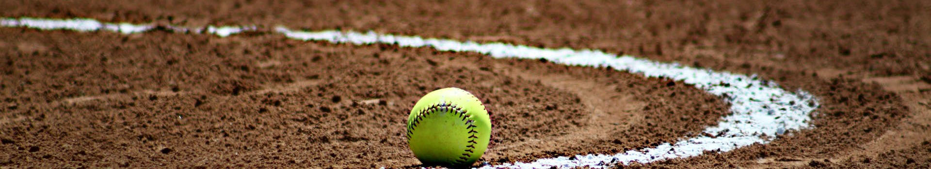 Softball on the ground in the infield